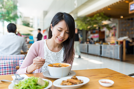 Asian woman eating soup rice starch